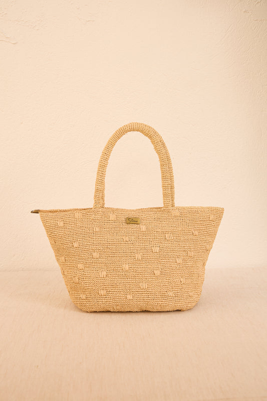 Bolsa de palha natural 'Gota' em formato orgânico, design rústico, perfeita para looks veraniegos e descontraídos.